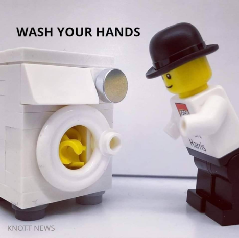 Image of LEGO man literally washing his LEGO hands in a LEGO washing machine. 